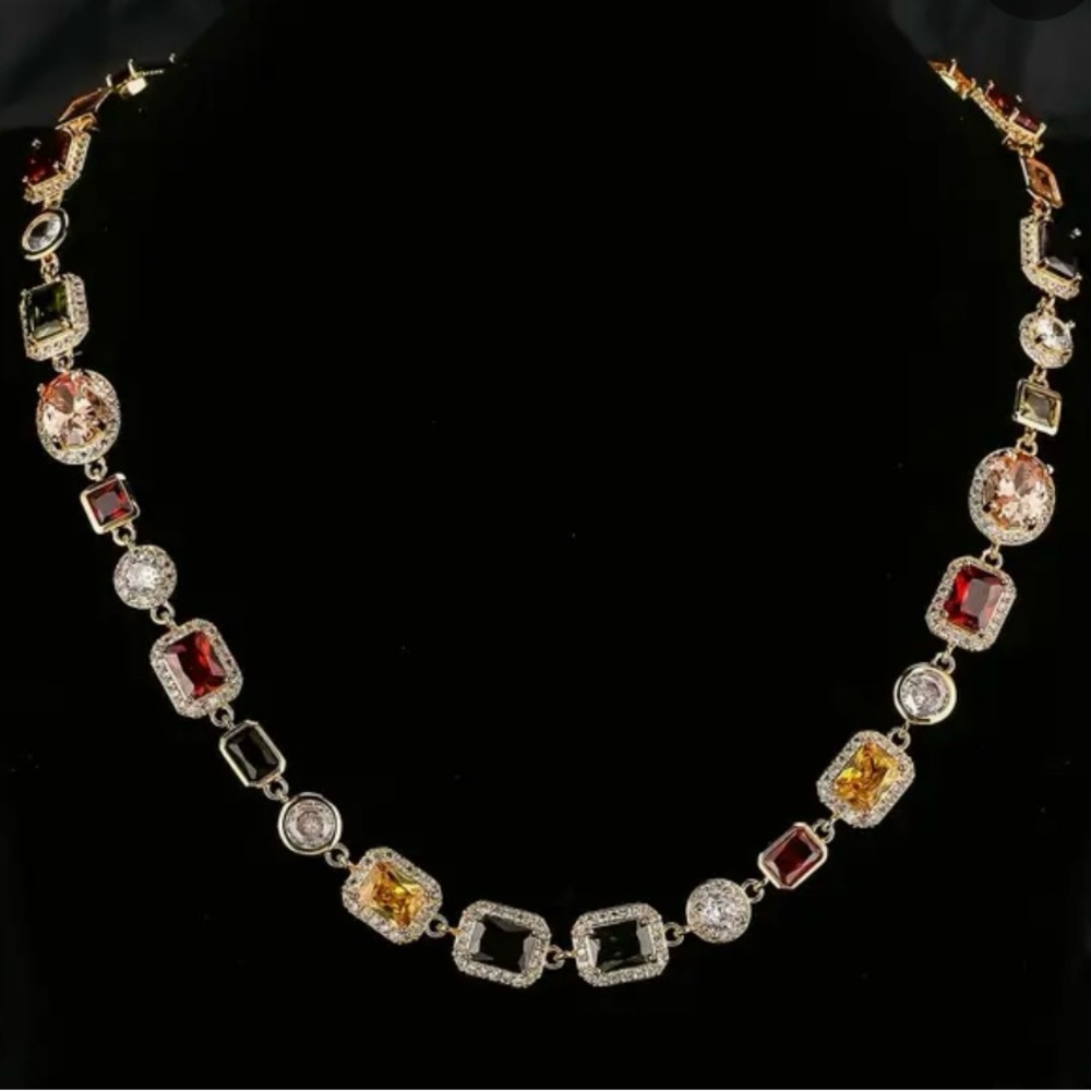 Multi color faux stone necklace surround CZ’s stones.Gold plated with extender.